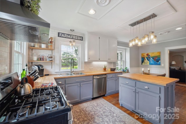 81 21st Ave NW, Hickory, NC 28601 - kitchen featuring butcher block counters, appliances with stainless steel finishes, a sink, ventilation hood, and recessed lighting