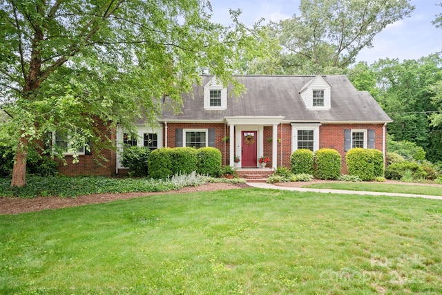 81 21st Ave NW, Hickory, NC 28601 - cape cod-style house featuring brick siding and a front lawn