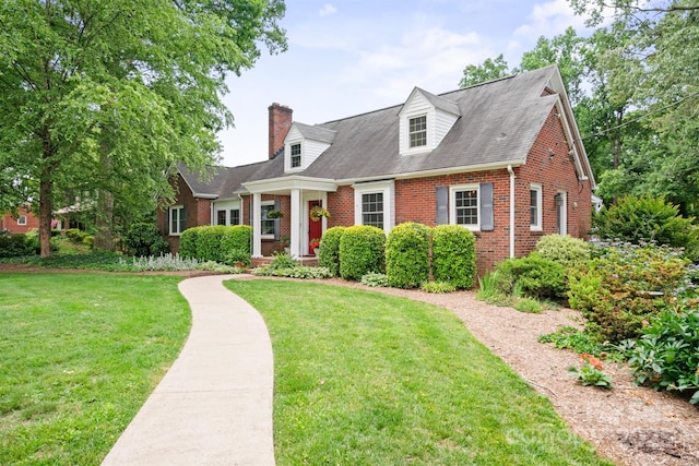 81 21st Ave NW, Hickory, NC 28601 - cape cod-style house with brick siding, a front yard, a chimney, and roof with shingles