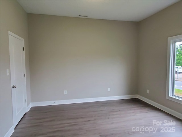 518 N Fulton St, Salisbury, NC 28144 - spare room with dark wood-style flooring and baseboards