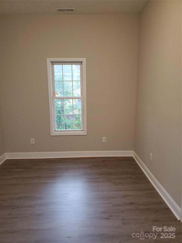518 N Fulton St, Salisbury, NC 28144 - unfurnished room featuring dark wood finished floors and baseboards