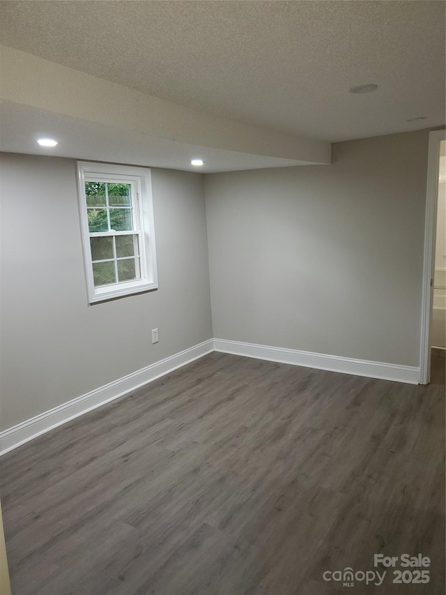 518 N Fulton St, Salisbury, NC 28144 - spare room featuring baseboards, dark wood-style flooring, recessed lighting, and a textured ceiling