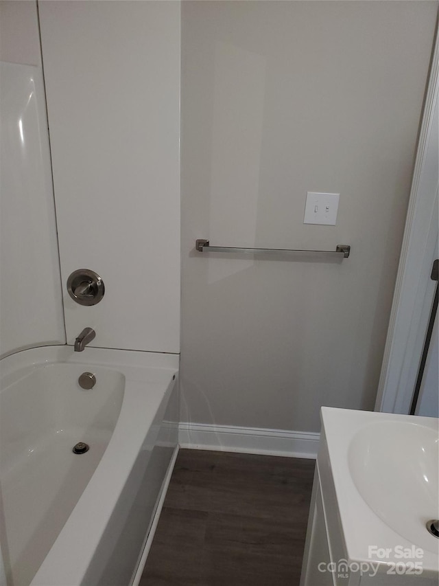 518 N Fulton St, Salisbury, NC 28144 - bathroom with baseboards, wood finished floors, and vanity