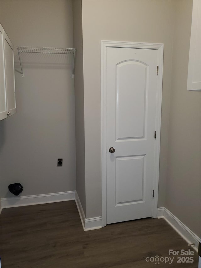 518 N Fulton St, Salisbury, NC 28144 - laundry room featuring dark wood-type flooring, baseboards, and cabinet space