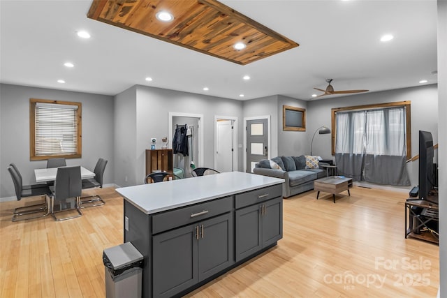 358 London Rd, Asheville, NC 28803 - kitchen with ceiling fan, a kitchen island, light wood-type flooring, light countertops, and recessed lighting