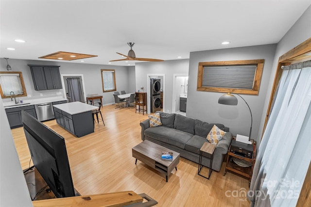 358 London Rd, Asheville, NC 28803 - living area with stacked washing machine and dryer, light wood-style flooring, a ceiling fan, recessed lighting, and baseboards