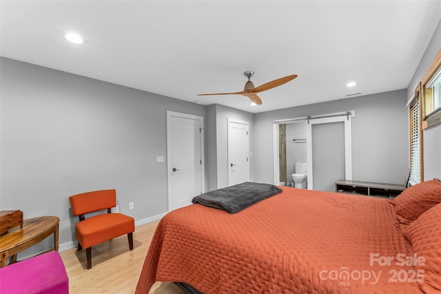 358 London Rd, Asheville, NC 28803 - bedroom with light wood-style floors, a barn door, recessed lighting, baseboards, and ceiling fan