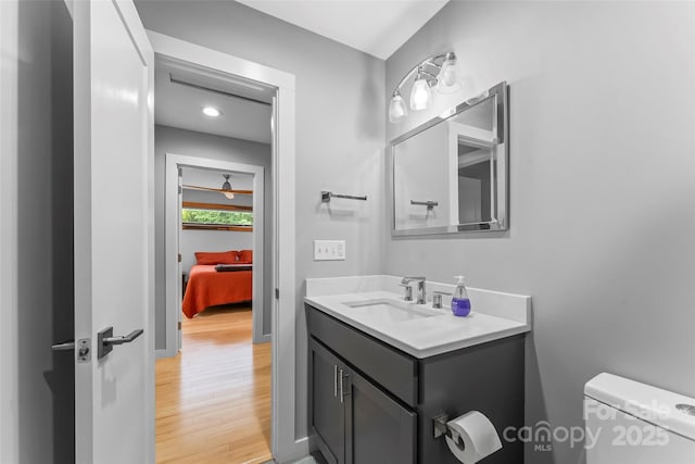 358 London Rd, Asheville, NC 28803 - bathroom featuring vanity, wood finished floors, toilet, recessed lighting, and ensuite bathroom