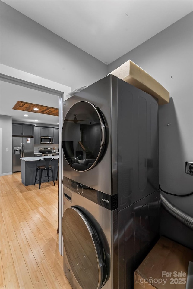 358 London Rd, Asheville, NC 28803 - laundry room with stacked washer / dryer and light wood-style floors