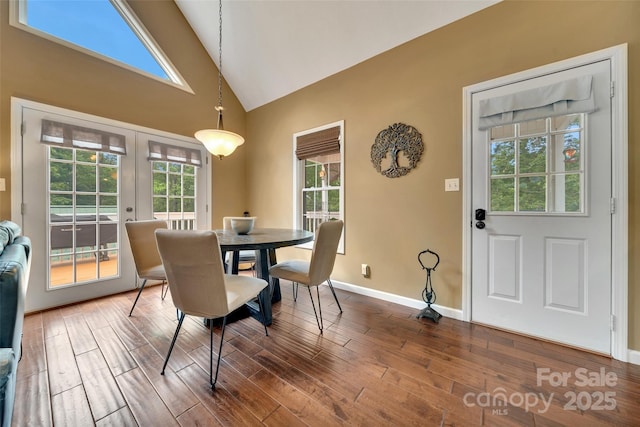 186 Hawks Point Dr, Zirconia, NC 28790 - dining area with french doors, wood finished floors, baseboards, and high vaulted ceiling