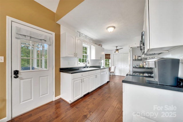 186 Hawks Point Dr, Zirconia, NC 28790 - kitchen with ceiling fan, a sink, dark countertops, and white cabinetry