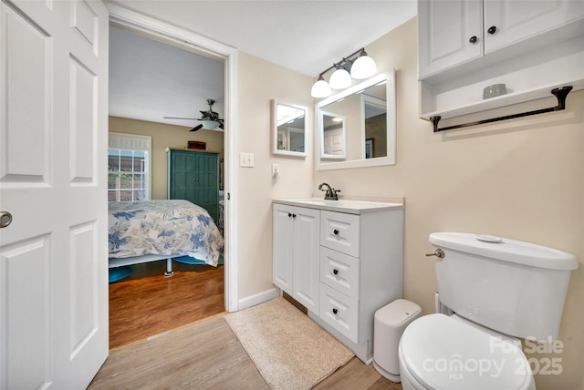 186 Hawks Point Dr, Zirconia, NC 28790 - ensuite bathroom featuring wood finished floors, vanity, toilet, and ceiling fan