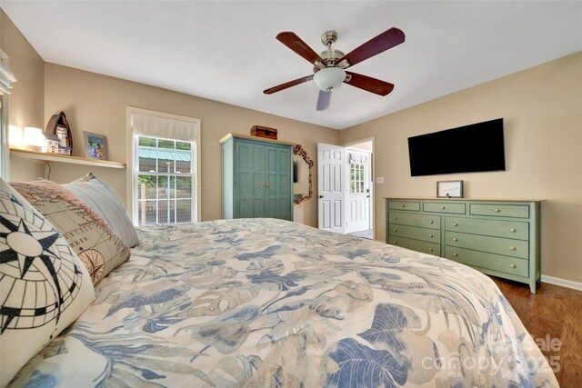 186 Hawks Point Dr, Zirconia, NC 28790 - bedroom with wood finished floors, baseboards, and a ceiling fan