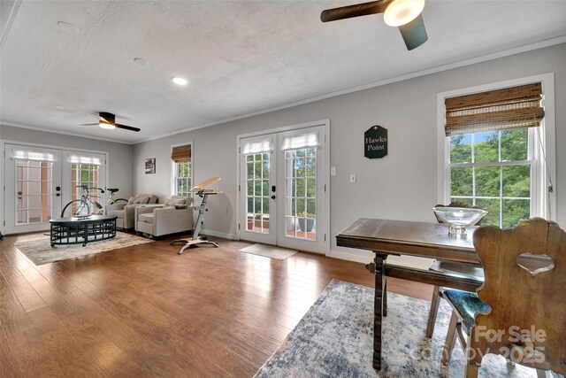 186 Hawks Point Dr, Zirconia, NC 28790 - living area with french doors, ceiling fan, ornamental molding, wood finished floors, and a textured ceiling