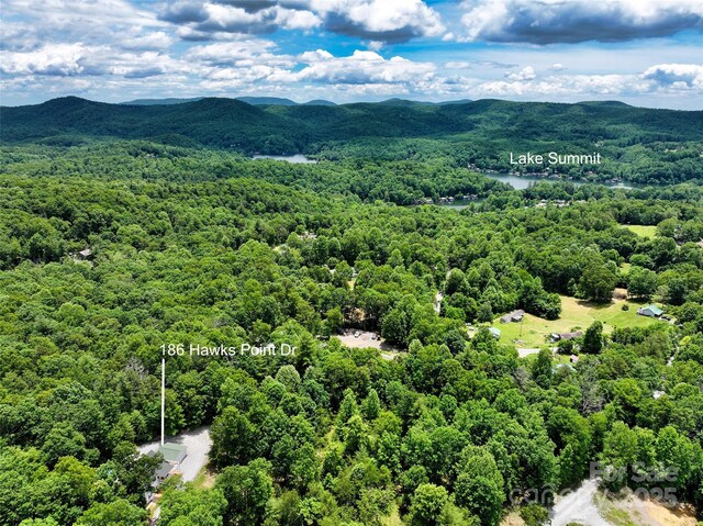 186 Hawks Point Dr, Zirconia, NC 28790 - aerial view of a heavily wooded area and a mountain backdrop
