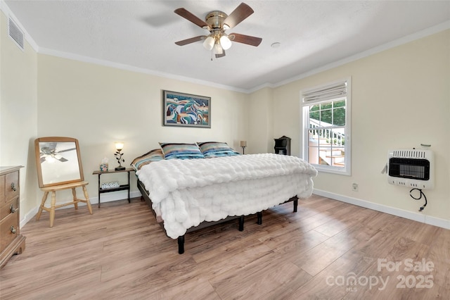 186 Hawks Point Dr, Zirconia, NC 28790 - bedroom with heating unit, light wood finished floors, ornamental molding, baseboards, and ceiling fan