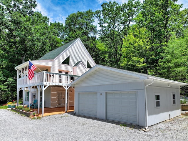 186 Hawks Point Dr, Zirconia, NC 28790 - view of front facade with a detached garage and a wooden deck