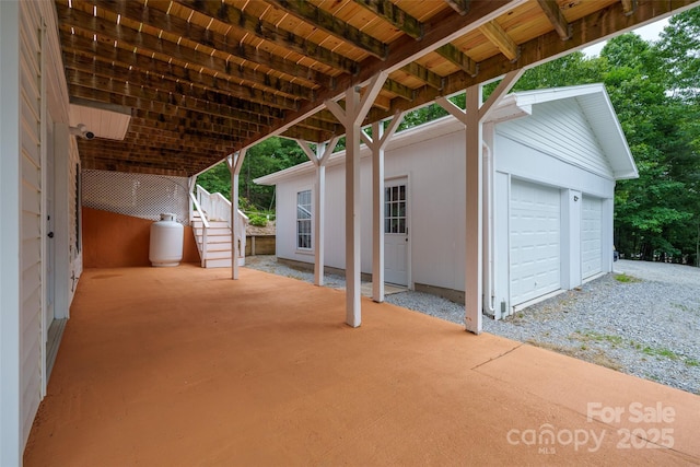 186 Hawks Point Dr, Zirconia, NC 28790 - view of patio / terrace with a garage, stairs, and an outdoor structure