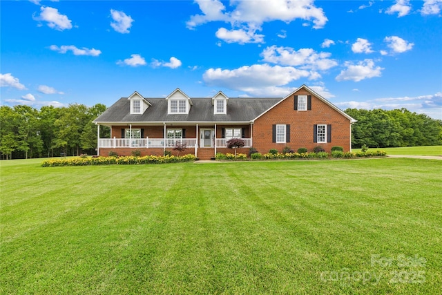 106 Laren Rd, Shelby, NC 28152 - cape cod-style house featuring a porch, a front yard, and brick siding