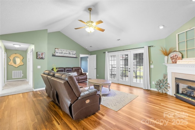 106 Laren Rd, Shelby, NC 28152 - living room with lofted ceiling, ceiling fan, wood finished floors, french doors, and a fireplace