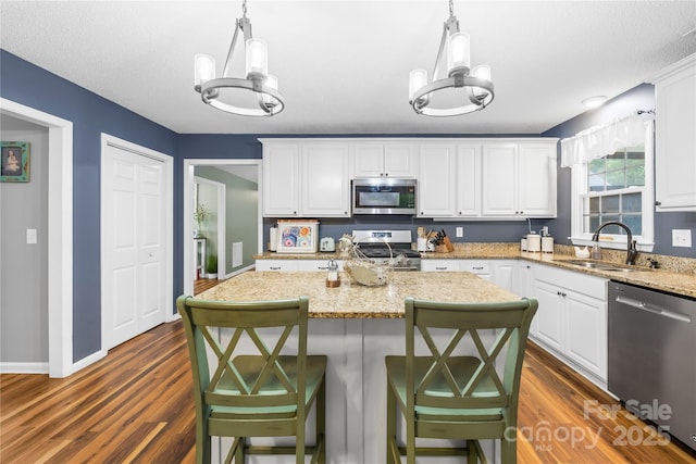 106 Laren Rd, Shelby, NC 28152 - kitchen featuring appliances with stainless steel finishes, white cabinets, and dark wood finished floors