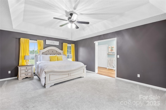 106 Laren Rd, Shelby, NC 28152 - carpeted bedroom with a tray ceiling and a ceiling fan