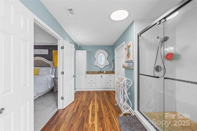 106 Laren Rd, Shelby, NC 28152 - ensuite bathroom with a shower stall, vanity, and wood finished floors