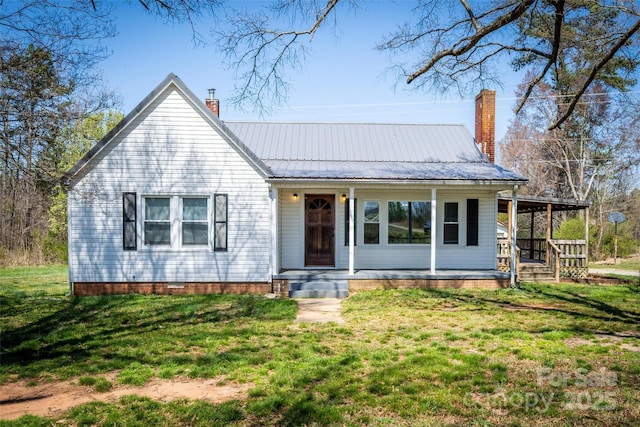 260 Penninger Dr, Woodleaf, NC 27054 - view of front of property with a chimney, covered porch, a front lawn, and metal roof