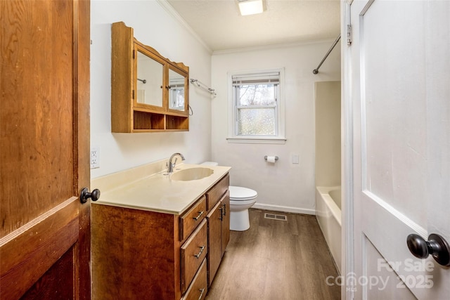 260 Penninger Dr, Woodleaf, NC 27054 - full bath featuring wood finished floors, vanity, toilet, crown molding, and shower / bath combination