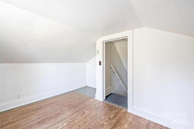 260 Penninger Dr, Woodleaf, NC 27054 - additional living space featuring wood finished floors, vaulted ceiling, and baseboards