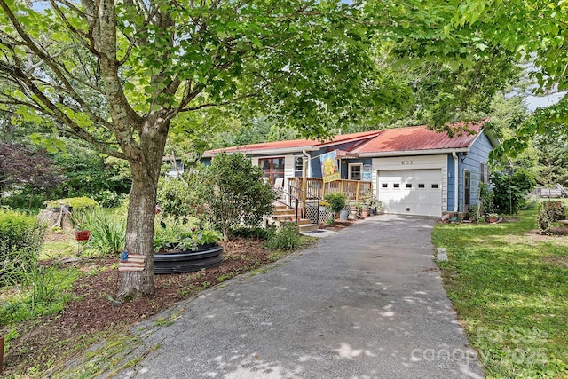 603 S Orchard Rd, Flat Rock, NC 28731 - ranch-style house featuring a garage, driveway, and metal roof
