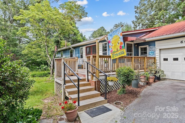 603 S Orchard Rd, Flat Rock, NC 28731 - view of front of property with a garage and metal roof