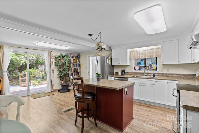 603 S Orchard Rd, Flat Rock, NC 28731 - kitchen with stainless steel appliances, a sink, a kitchen island, and white cabinets