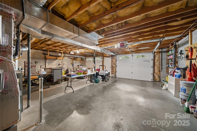 12 Surrey Run, Hendersonville, NC 28791 - garage with a garage door opener and a workshop area