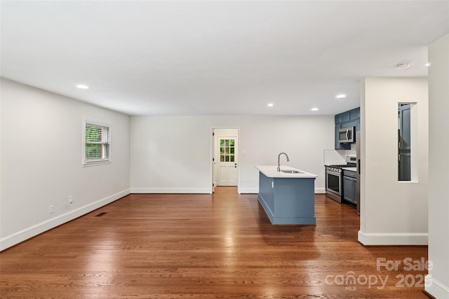 4906 Charleston Dr, Charlotte, NC 28212 - kitchen with stainless steel appliances, healthy amount of natural light, light countertops, dark wood-style floors, and recessed lighting