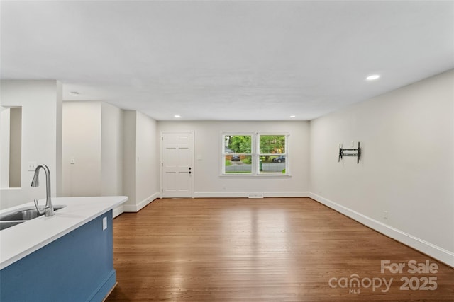 4906 Charleston Dr, Charlotte, NC 28212 - unfurnished living room featuring wood finished floors and recessed lighting