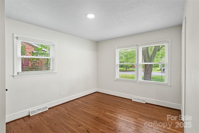 4906 Charleston Dr, Charlotte, NC 28212 - empty room featuring baseboards and wood finished floors