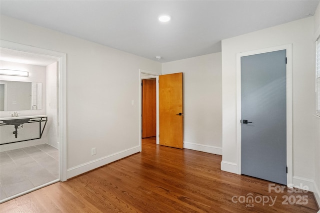 4906 Charleston Dr, Charlotte, NC 28212 - unfurnished bedroom featuring wood finished floors and ensuite bath