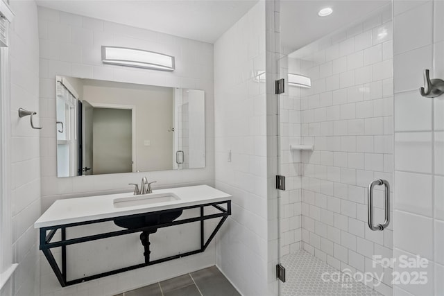 4906 Charleston Dr, Charlotte, NC 28212 - bathroom with tile walls, a stall shower, vanity, and tile patterned floors