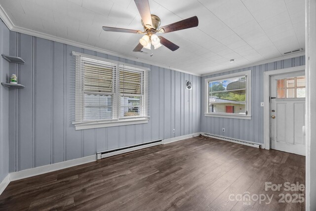 216 Hillcrest Pl, Salisbury, NC 28144 - empty room featuring a baseboard radiator, ornamental molding, baseboard heating, wood finished floors, and a ceiling fan