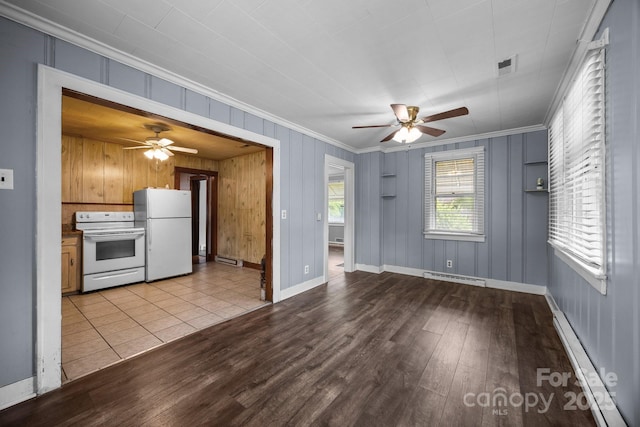 216 Hillcrest Pl, Salisbury, NC 28144 - unfurnished living room with a ceiling fan, ornamental molding, a baseboard heating unit, wood finished floors, and baseboards