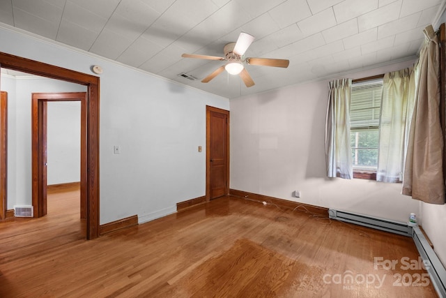 216 Hillcrest Pl, Salisbury, NC 28144 - empty room with baseboard heating, ornamental molding, wood finished floors, and a ceiling fan