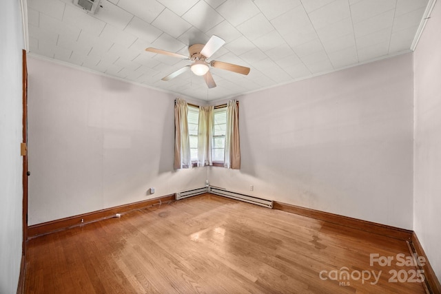 216 Hillcrest Pl, Salisbury, NC 28144 - unfurnished room featuring crown molding, wood finished floors, baseboards, ceiling fan, and a baseboard radiator