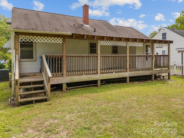 216 Hillcrest Pl, Salisbury, NC 28144 - back of house featuring a chimney, central AC, a yard, and a deck