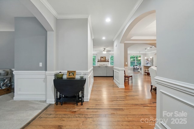 110 St Sophia Ct, Mooresville, NC 28117 - hallway featuring arched walkways, crown molding, light wood finished floors, and recessed lighting