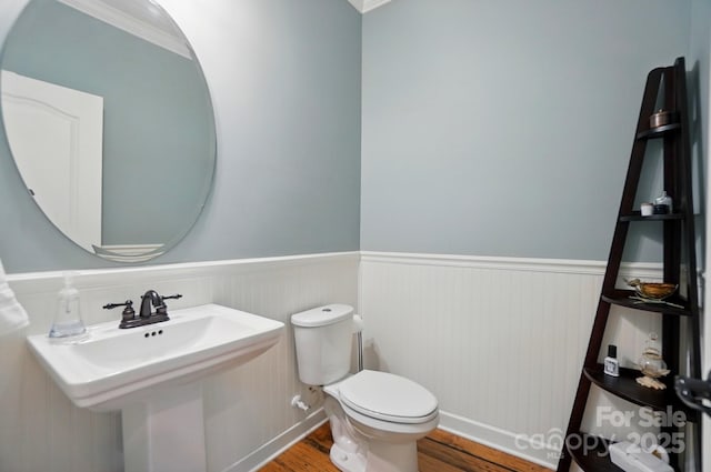 110 St Sophia Ct, Mooresville, NC 28117 - half bathroom with wood finished floors, wainscoting, toilet, and crown molding