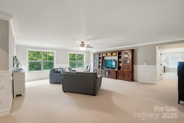 110 St Sophia Ct, Mooresville, NC 28117 - carpeted living area with a ceiling fan, crown molding, and healthy amount of natural light