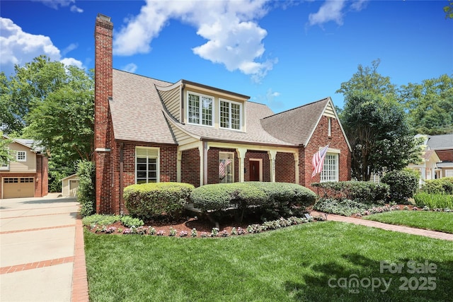 1021 Isleworth Ave, Charlotte, NC 28203 - view of front facade with brick siding, roof with shingles, and a chimney