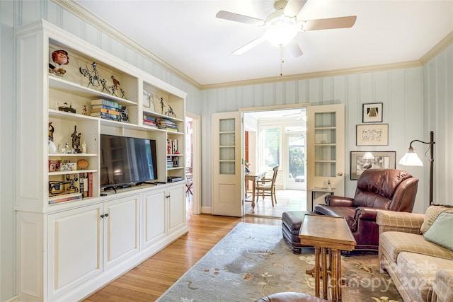 1021 Isleworth Ave, Charlotte, NC 28203 - living area featuring light wood-style floors, ceiling fan, and crown molding