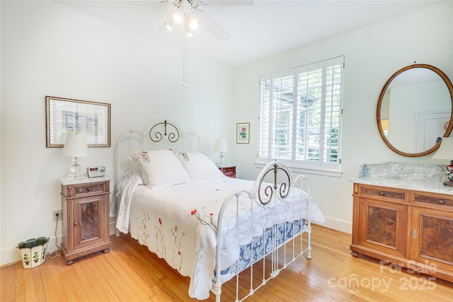 1021 Isleworth Ave, Charlotte, NC 28203 - bedroom with light wood-type flooring, baseboards, and ceiling fan